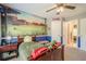 Charming bedroom features a baseball themed mural, ceiling fan and neutral carpet at 1010 Forest Creek Dr, Canton, GA 30115