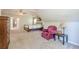 Bedroom displaying neutral paint, carpet, and a comfortable sitting area at 1010 Forest Creek Dr, Canton, GA 30115