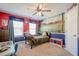 Charming bedroom with baseball mural, and a ceiling fan at 1010 Forest Creek Dr, Canton, GA 30115