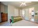 Cozy bedroom features a ceiling fan, neutral carpet and ensuite access at 1010 Forest Creek Dr, Canton, GA 30115