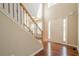 Bright and spacious foyer boasting hardwood floors, a staircase with wrought iron spindles, and natural light at 1010 Forest Creek Dr, Canton, GA 30115