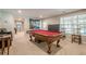 Game room with a pool table and window view to backyard at 1010 Forest Creek Dr, Canton, GA 30115