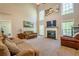 Bright and airy living room with high ceilings, fireplace, and comfortable seating at 1010 Forest Creek Dr, Canton, GA 30115