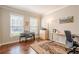 Office space featuring hardwood floors, a decorative rug, and an abundance of natural light at 1010 Forest Creek Dr, Canton, GA 30115