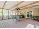Inviting screened-in patio with ceiling fan and outdoor furniture, great for relaxation and gatherings at 1010 Forest Creek Dr, Canton, GA 30115
