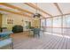 Spacious screened-in porch with ceiling fan, outdoor furniture and grilling area at 1010 Forest Creek Dr, Canton, GA 30115