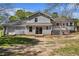 Spacious backyard with a large deck, mature trees, and plenty of room for outdoor activities at 2914 Stanton Se Rd, Conyers, GA 30094