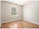Bedroom features a window with view, and hardwood floors at 2914 Stanton Se Rd, Conyers, GA 30094