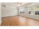 Generously sized bedroom with bright windows and pristine hardwood flooring at 2914 Stanton Se Rd, Conyers, GA 30094