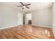 Spacious bedroom with hardwood floors and a view of an adjacent bathroom at 2914 Stanton Se Rd, Conyers, GA 30094