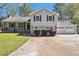 Charming two-story home with a well-manicured front yard and a three-car garage at 2914 Stanton Se Rd, Conyers, GA 30094