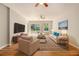 Bright, inviting living room with hardwood floors, plush seating, and a ceiling fan at 2914 Stanton Se Rd, Conyers, GA 30094