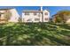 Expansive backyard featuring a well-maintained lawn and a basketball hoop for outdoor activities at 3448 Clear Stream Ne Run, Auburn, GA 30011