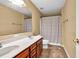 Spacious bathroom featuring a double vanity sink and shower with a curtain at 3448 Clear Stream Ne Run, Auburn, GA 30011