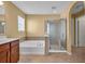Inviting bathroom boasts a tub, separate shower, and neutral tile flooring at 3448 Clear Stream Ne Run, Auburn, GA 30011