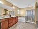 Well-appointed bathroom featuring a separate shower, soaking tub, and large double vanity at 3448 Clear Stream Ne Run, Auburn, GA 30011