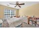 Bedroom featuring a bright window, neutral walls, carpet, and wooden dresser at 3448 Clear Stream Ne Run, Auburn, GA 30011