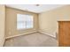 Small bedroom featuring carpeted floors and natural light coming through the window at 3448 Clear Stream Ne Run, Auburn, GA 30011