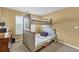 Cozy bedroom features a charming bunk bed with a sturdy ladder and neutral color scheme at 3448 Clear Stream Ne Run, Auburn, GA 30011