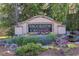 Elegant community entrance sign, 'Brookside Crossing,' adorned with colorful flowers and greenery at 3448 Clear Stream Ne Run, Auburn, GA 30011