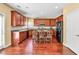Stylish kitchen featuring an island with seating, stainless steel appliances, and hardwood floors at 3448 Clear Stream Ne Run, Auburn, GA 30011