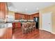 Bright kitchen with stainless steel appliances, an island with seating, and ample cabinet space at 3448 Clear Stream Ne Run, Auburn, GA 30011