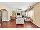 Bright living room featuring a ceiling fan, fireplace, hardwood floors and neutral-colored furniture at 3448 Clear Stream Ne Run, Auburn, GA 30011