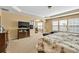 Bright and airy main bedroom features a large television, sitting area, and plenty of natural light at 3448 Clear Stream Ne Run, Auburn, GA 30011