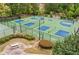 Aerial view showcasing newly built and well-maintained pickleball courts for community members at 3448 Clear Stream Ne Run, Auburn, GA 30011