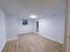 Finished basement with light vinyl flooring, white paneling and a back door at 2637 Sol Ct, Ellenwood, GA 30294