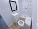 Well-lit bathroom featuring a modern vanity, shower, and toilet at 2637 Sol Ct, Ellenwood, GA 30294