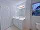 Clean bathroom with vanity, modern lighting, and white fixtures at 2637 Sol Ct, Ellenwood, GA 30294
