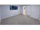 Bedroom with neutral walls, gray carpet, and a window at 2637 Sol Ct, Ellenwood, GA 30294
