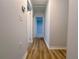 Hallway with fresh paint and stylish flooring, connects various rooms seamlessly at 2637 Sol Ct, Ellenwood, GA 30294