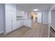 Bright kitchen boasts granite countertops, white cabinets, and modern appliances at 2637 Sol Ct, Ellenwood, GA 30294