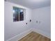 Bright laundry room featuring vinyl flooring, window for natural light, and washer/dryer hookups at 2637 Sol Ct, Ellenwood, GA 30294