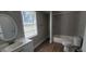 Bathroom featuring a tub/shower combo, and a toilet at 2917 Joe Jerkins Blvd, Austell, GA 30106