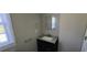 Bathroom with a dark vanity, and a large mirror at 2917 Joe Jerkins Blvd, Austell, GA 30106