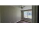 Bedroom with wood-look flooring and natural light from the large window at 2917 Joe Jerkins Blvd, Austell, GA 30106