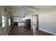 Open kitchen features white cabinets, modern appliances, and wood-look flooring at 2917 Joe Jerkins Blvd, Austell, GA 30106
