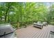 Inviting back deck with outdoor seating and a grill, perfect for entertaining at 5276 Weatherwood Trce, Marietta, GA 30068