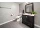 Bathroom features sleek vanity, updated fixtures and tiled floors at 5276 Weatherwood Trce, Marietta, GA 30068