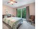 Comfortable bedroom with carpeted floor, scenic backyard view from large window at 5276 Weatherwood Trce, Marietta, GA 30068