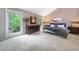 Primary bedroom is spacious with neutral decor, large windows, and hardwood floors at 5276 Weatherwood Trce, Marietta, GA 30068