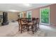Bright dining area with large windows and exercise equipment in the background at 5276 Weatherwood Trce, Marietta, GA 30068