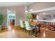Bright dining area with hardwood floors, stylish lighting, and open access to the kitchen at 5276 Weatherwood Trce, Marietta, GA 30068