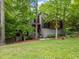 Unique contemporary home nestled among mature trees, featuring modern design and attractive landscaping at 5276 Weatherwood Trce, Marietta, GA 30068