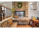 Inviting seating area features a brick fireplace with a decorative wreath, and hardwood floors at 5276 Weatherwood Trce, Marietta, GA 30068