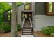 Contemporary home with a unique architectural design, featuring a stairway leading to the entrance at 5276 Weatherwood Trce, Marietta, GA 30068