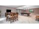 Open concept game room with a pool table, dining area, and bar at 5276 Weatherwood Trce, Marietta, GA 30068